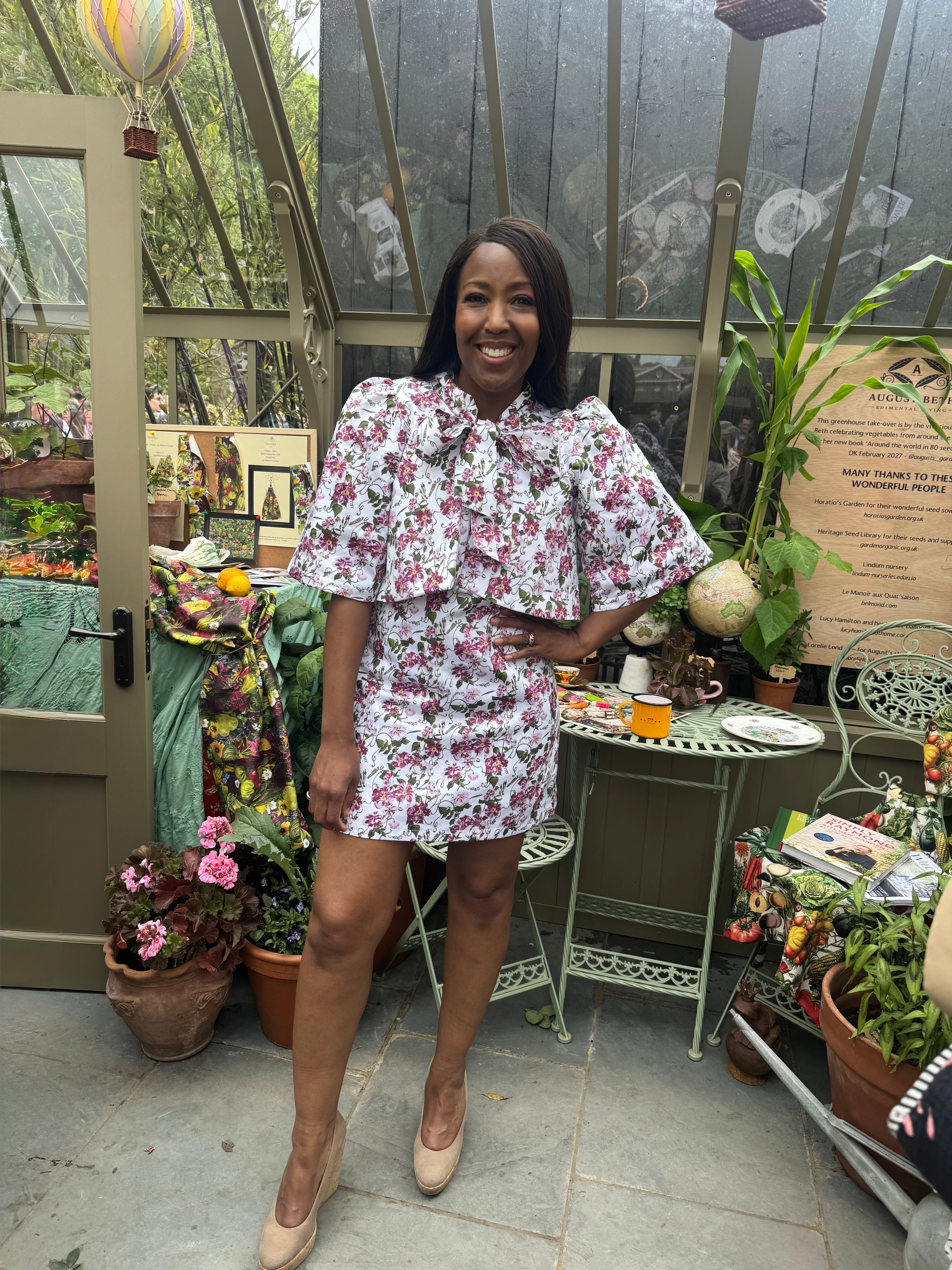 Angellica Bell at RHS Chelsea 2026 Alitex Greenhouse Floral Bow Neck Dress Bow Neck Swing Jacket and Shift Dress. Pink and white Floral Bow Neck outfit Chelsea Lorelei London Pink Floral Print Inspired by The Kings Rose. Floral Mini Dress with Bow and sleeves. What was Angellica Bell wearing at RHS Chelsea on Friday 22nd May 2026. Made in The Uk, Sustainable Fashion Brand