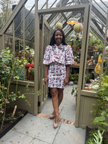 Angellica Bell at RHS Chelsea 2026 Alitex Greenhouse Floral Bow Neck Dress Bow Neck Swing Jacket and Shift Dress. Pink and white Floral Bow Neck outfit Chelsea Lorelei London Pink Floral Print Inspired by The Kings Rose. Floral Mini Dress with Bow and sleeves. What was Angellica Bell wearing at RHS Chelsea on Friday 22nd May 2026