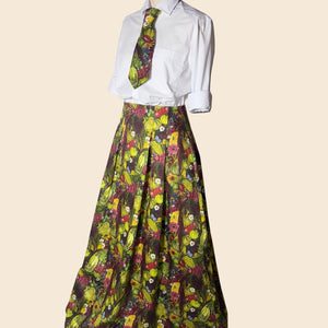 Side angle view of the August Beth bespoke skirt and tie designed for RHS Chelsea Press Day 2026. Vegetable print inspired by the gardens at Le manoir and The Around The World in 80 Seeds.