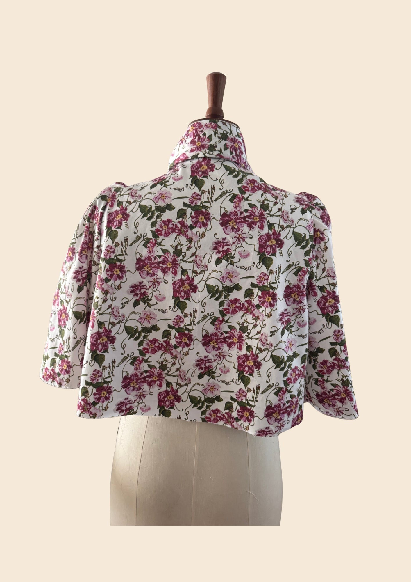 Back View on Mannequin of The Lorelei London Bow Swing Jacket part of a Two Piece set worn by Angellica Bell at RHS Chelsea 0n 22nd May 2026. Bow Dress style as seen on Angellica Bell. Sold separately Pink trailing floral print. What was Angellica wearing at Chelsea
