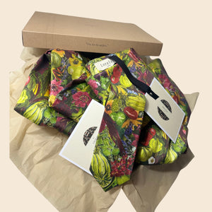 A boxed up parcel ready for delivery of the Vegetable Print inspired by the gardens at Le Manoir.  Bespoke Print and design created for August Beth to celebrate her collaboration with Alitex on Main Avenue at The Chelsea Flower Show Worn on press day in her vegetable emporium.