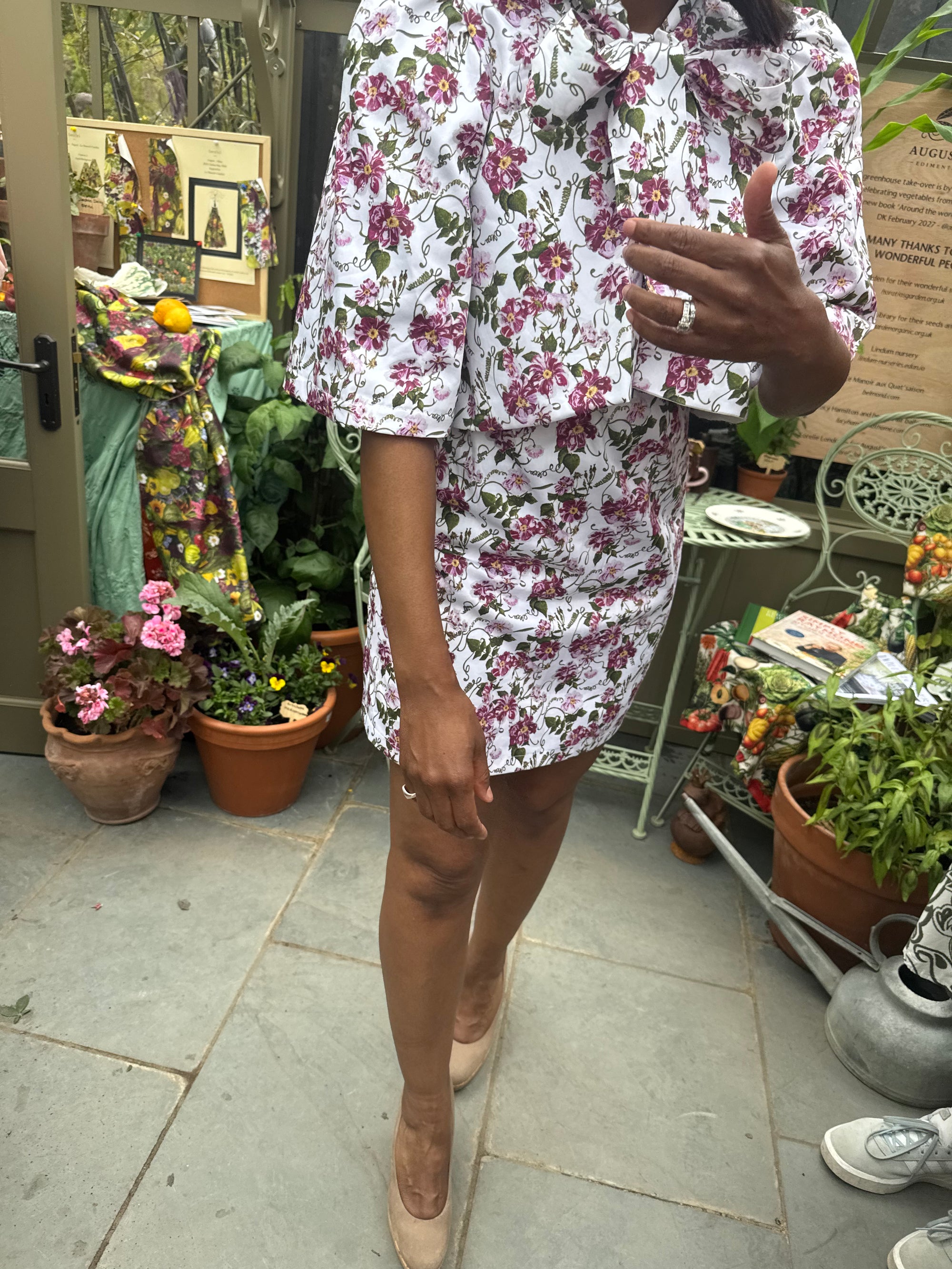 The most beutiful floral climbing print at Chelsea.Angellica Bell at RHS Chelsea 2026 Alitex Greenhouse Floral Bow Neck Dress Bow Neck Swing Jacket and Shift Dress. Pink and white Floral Bow Neck outfit Chelsea Lorelei London Pink Floral Print Inspired by The Kings Rose. Floral Mini Dress with Bow and sleeves. What was Angellica Bell wearing at RHS Chelsea on Friday 22nd May 2026. Made in The Uk, Sustainable Fashion Brand. August Beth Le Manoir