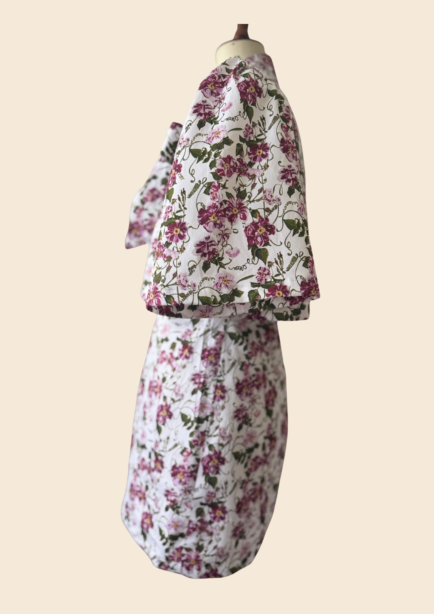 The_Bow_Swing_Jacket_Shift_Dress_in_a_trailing_Pink_Floral_Rose_print_inspired_by_The_Kings_Rose. Flat lay side view as seen on Angellica Bell at RHS Chelsea 2026. Iplayer Episode 9 on the BBC with MAry Berry giving out THe people choice award. Alitex Lorelei London Sustainable fashion brand.