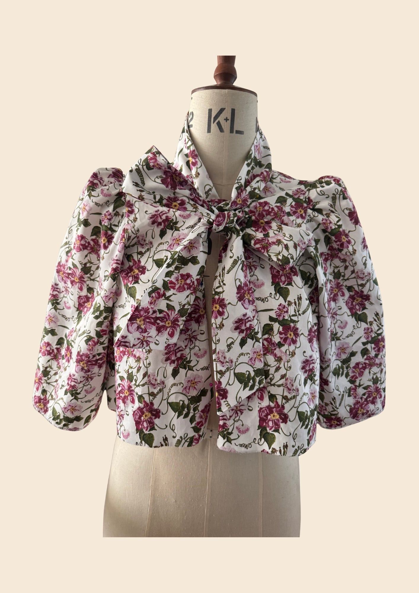 Floral Swing Jacket Blouse on a mannequin. Print by Lorelei London inspired by The Kings Rose. As seen on Angellica Bell at RHS Chelsea 2026. What was Angellica Bell wearing this year at The Chelsea Flower Show. Mini Floral Bow  Dress. As seen on the BBC